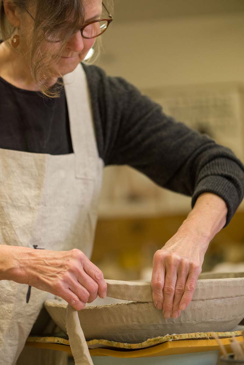 Janet Lines during the creation of a ceramic